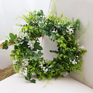 Lush artificial tulip and eucalyptus wreath with white flowers for spring door decor