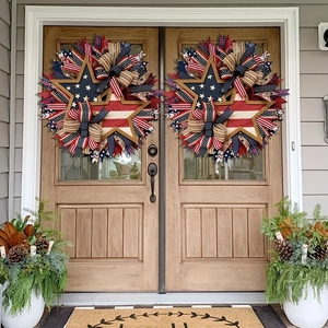 Patriotic Independence Day wreaths with red white blue ribbons and wooden stars on wooden doors