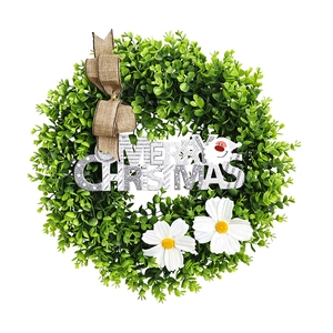 Eucalyptus Christmas wreath with burlap bow and Merry Christmas sign on white background