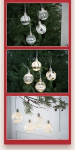 Macro detail of LED Christmas bulb ornaments with white glitter stripes on a festive tree
