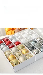 Detail of 8cm painted Christmas balls with glitter snowflake patterns in a gift box