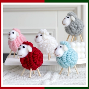 Close-up of colorful wool felt sheep figurines with wooden legs for Christmas decor