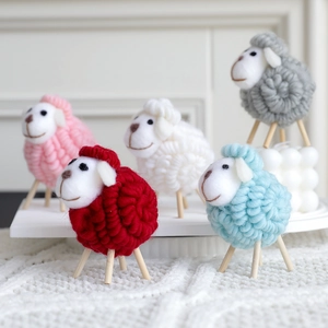 Handmade wool felt sheep figurines in five colors for cozy Christmas home decoration