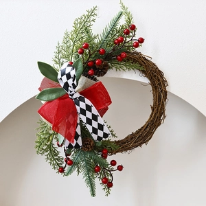 Christmas wreath with pine cones and red berries on a natural vine base decoration