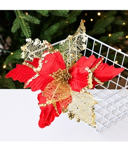 Detail of velvet gold glitter poinsettia flower on a Christmas tree background