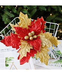 Detail of glittered red poinsettia flower in a white basket with festive bokeh lights
