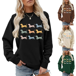 Detail of female crewneck sweatshirt showing nine colorful dachshund print variations