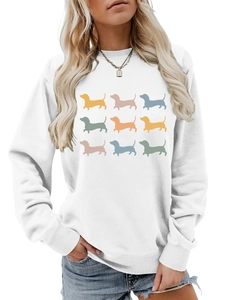 Detail of white crewneck sweatshirt featuring nine colorful dachshund silhouettes print