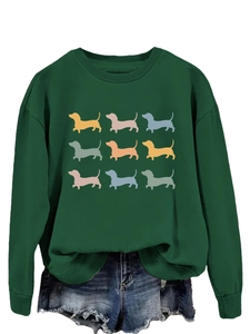 Detail of dark green sweatshirt featuring a colorful 3x3 grid of nine dachshund silhouettes