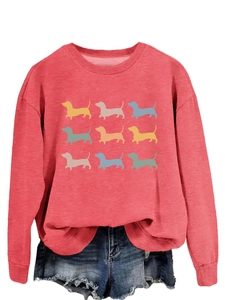 Detail of red crewneck sweatshirt with nine dachshund prints and denim shorts set