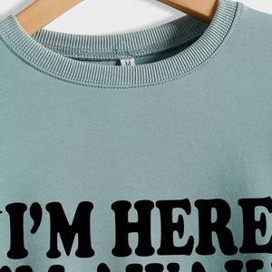 Blue crewneck sweatshirt with I'M HERE printed text and high quality knit fabric