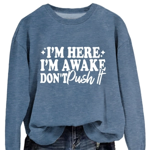 Blue crewneck sweatshirt with I'm Here I'm Awake white slogan and star graphic