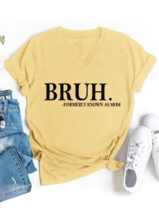 Flat lay of a mustard yellow V-neck T-shirt with BRUH print and denim jeans