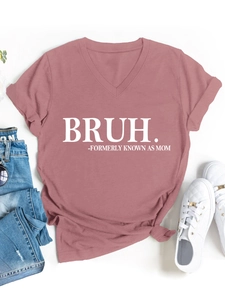 Dusty rose V-neck tee with white BRUH text print paired with light blue denim jeans