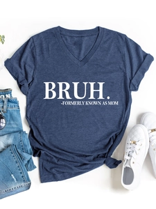 Macro detail of V-neck T-shirt showing navy fabric texture and BRUH text print