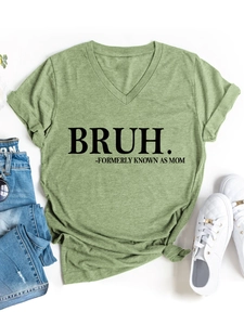 Flat lay of green V-neck T-shirt with BRUH FORMERLY KNOWN AS MOM print and jeans