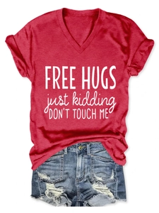 Detail of red V-neck T-shirt with Free Hugs print and textured fabric finish