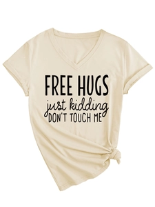 Close-up of V-neck T-shirt with front knot detail and Free Hugs slogan print