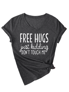 Detail of charcoal grey V-neck T-shirt with 'Free Hugs' print and side knot detail