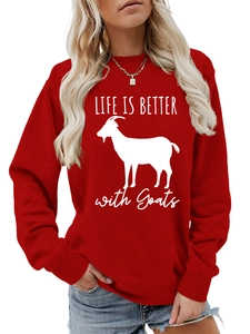 Detail of red crewneck sweatshirt featuring white goat silhouette and graphic print