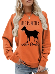 Close-up of orange crew neck sweatshirt with 'LIFE IS BETTER with Goats' print design