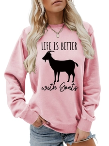 Close-up of pink crewneck sweatshirt with Life Is Better with Goats graphic print