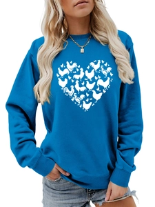 Detail of royal blue sweatshirt showing heart-shaped chicken graphic and rib cuffs