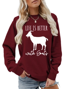 Detail of maroon crewneck sweatshirt with Life is Better with Goats graphic print