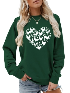Detail of dark green heart-shaped chicken and egg print on long-sleeve crewneck sweatshirt