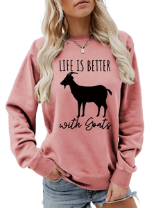Detail of pink crewneck sweatshirt featuring Life is Better with Goats print and ribbed cuffs