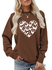 Detailed close-up of rural heart-shaped chicken and egg print on brown sweatshirt