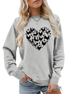 Detail of light grey sweatshirt featuring heart-shaped chicken silhouettes and ribbed cuffs