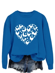 Detail of blue crewneck sweatshirt featuring white chicken silhouette heart print pattern