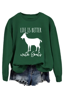Detail of goat print and LIFE IS BETTER text on dark green crewneck sweatshirt
