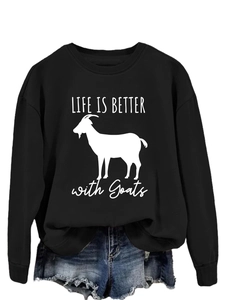 Detail of black crewneck sweatshirt with white goat silhouette and Life Is Better quote