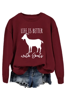 Close-up of LIFE IS BETTER with Goats slogan on dark red crewneck sweatshirt