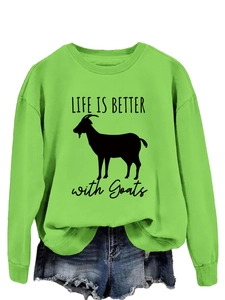 Close-up of LIFE IS BETTER with Goats text and goat graphic on bright green sweatshirt