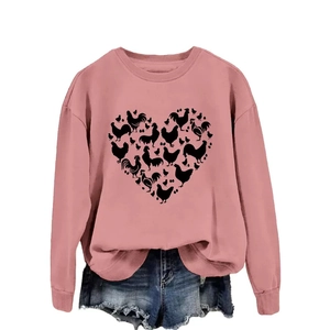 Pink crewneck sweatshirt with heart chicken silhouettes and raw hem denim shorts