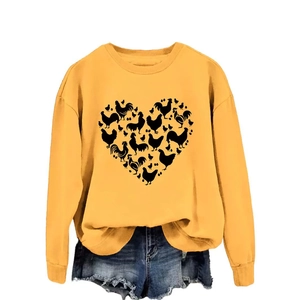 Ginger yellow sweatshirt featuring a unique heart-shaped chicken pattern and ribbed cuffs