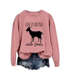 Pink crew neck sweatshirt with Life Is Better with Goats print and denim shorts