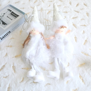 Detail of white plush angel ornaments with sequined hats and fluffy feather skirts
