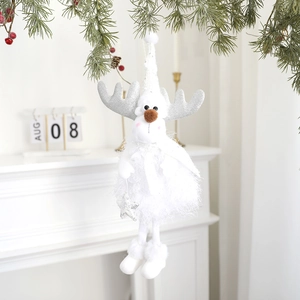 Close-up of a white plush Christmas reindeer ornament with silver antlers and a star