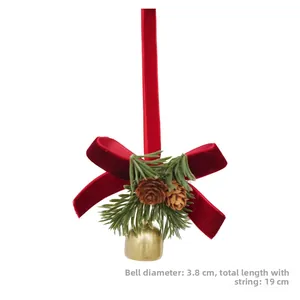 Detail of Christmas bell ornament with red velvet bow, pine cones, and size dimensions