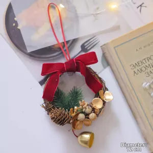 Close-up of 12cm Christmas wreath pendant with red bow, pine cones and gold bell