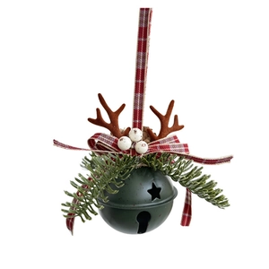 Detail of Christmas bell ornament with reindeer antlers, pine needles and plaid ribbon