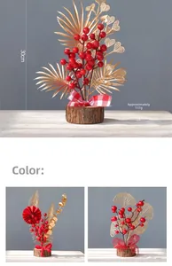 Detail of red berries and golden leaves on a 30cm festive New Year desk decoration