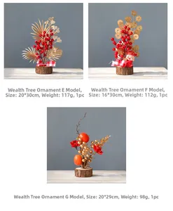 Detail of New Year red berry tree decorations with gold leaves on wooden base