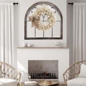Rustic off-white ruffled linen wreath with a large brown burlap bow for St. Patrick's Day