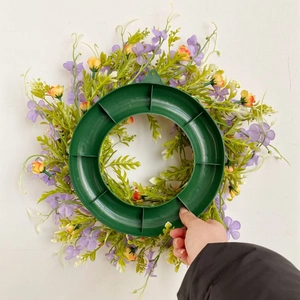 Artificial purple flower wreath with green leaves for home wall and door decoration