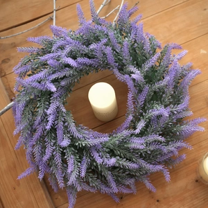 French country style lavender wreath with realistic purple buds on rustic wooden background